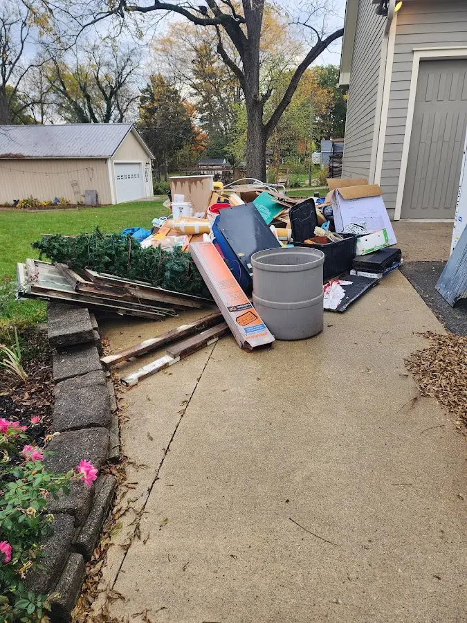 Dumpster being loaded with debris for 3 Yard Dumpster Rental in River Rouge